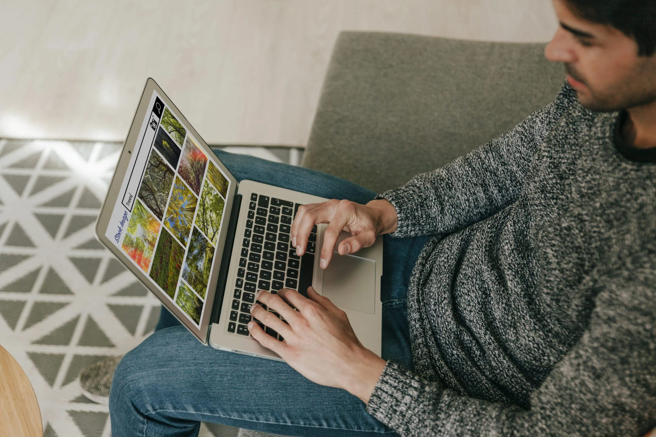 high-angle-adult-searching-stock-images-laptop (1)
