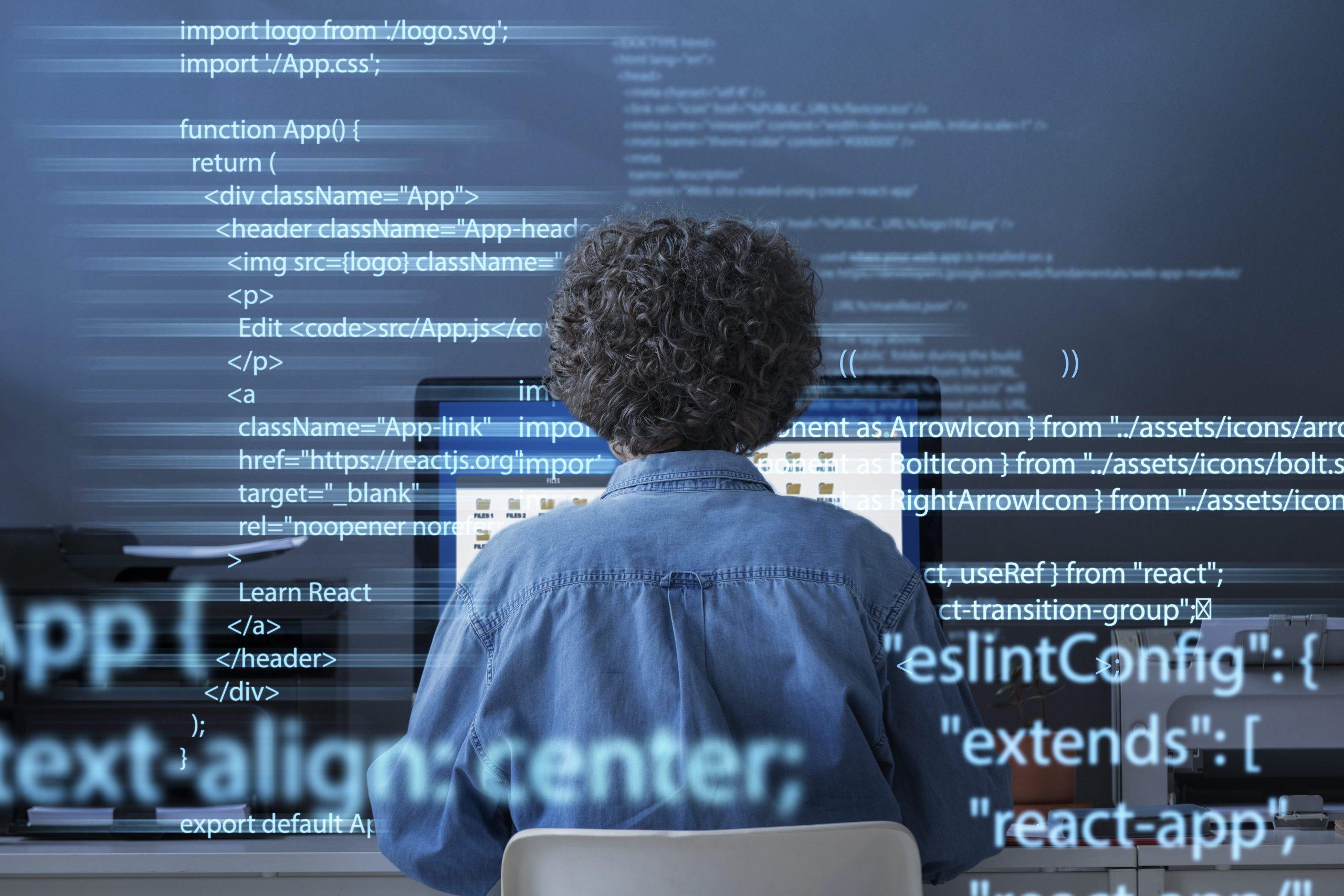 programming-background-with-person-working-with-codes-computer (1)